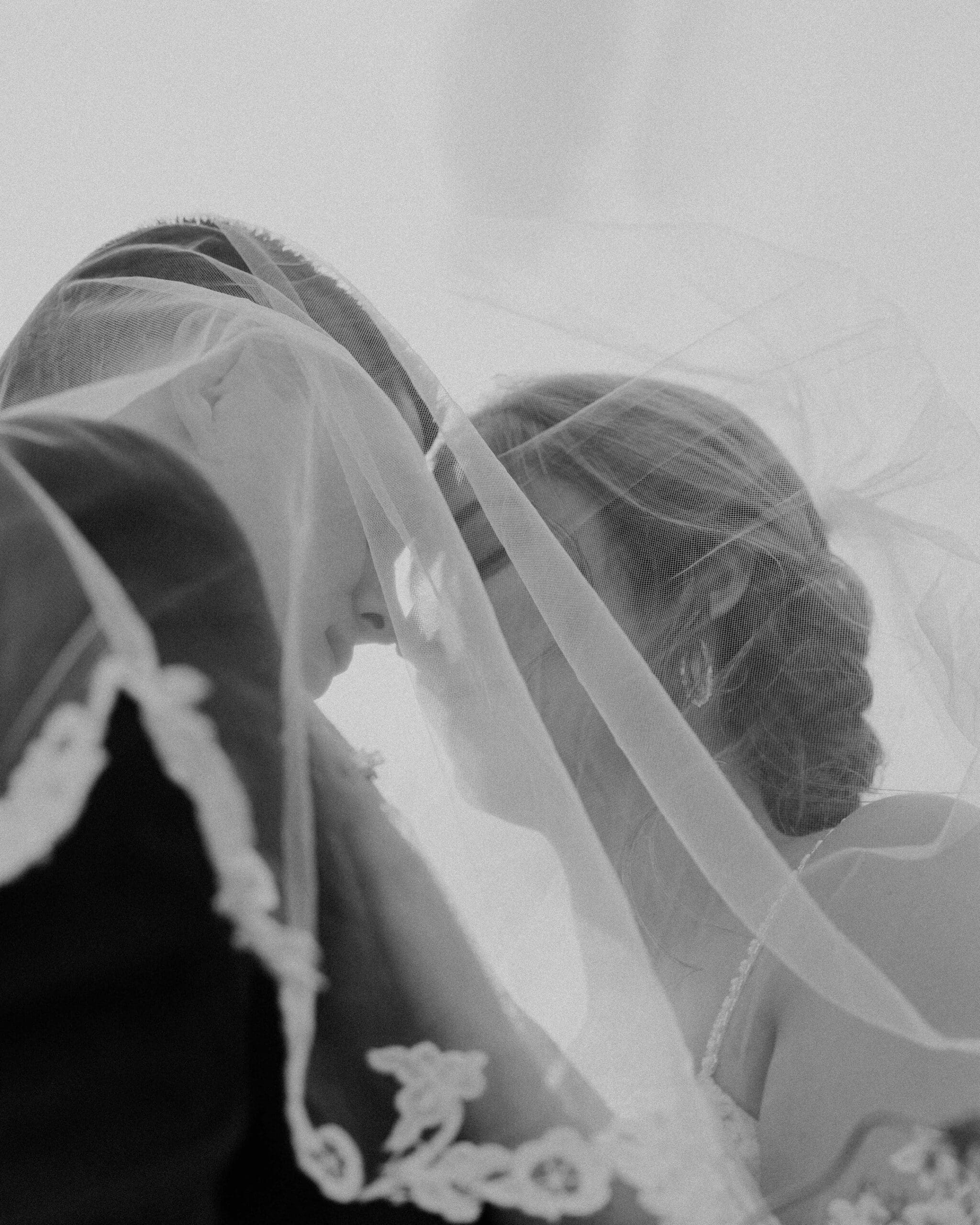 Bride wearing a veil during wedding preparations, featured image for a guide on what every wedding content creator website needs.